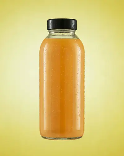 Juice Bottle Sticker Mockup Front View With Condensation Drops On Transparent Glass Against Yellow Background 0182
