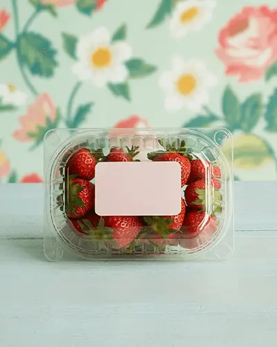 Strawberry Packaging Sticker Mockup On Transparent Container With Pink Label And Floral Background 0200