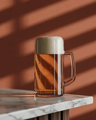 Beer Mug Sticker Mockup On Clear Glass With Foam Head On Marble Table In Sunlit Room With Warm Shadows 0206