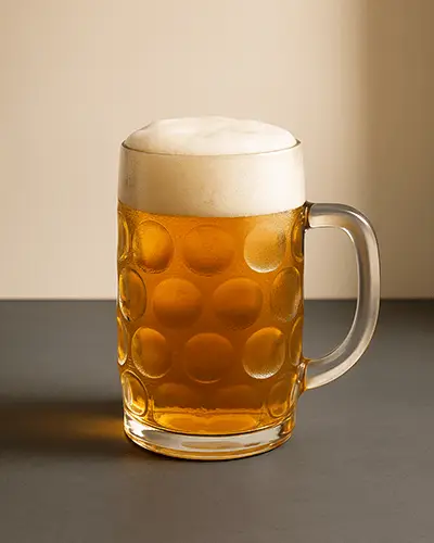 Studio Lit Beer Mug Sticker Mockup With Amber Drink And Foam Head On Warm Neutral Background 0218