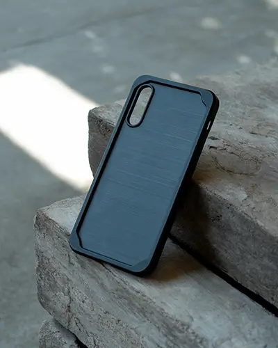 Phone Case Sticker Mockup Black Brushed Backdrop Against Outdoor Stone Step Textured Setting 0227