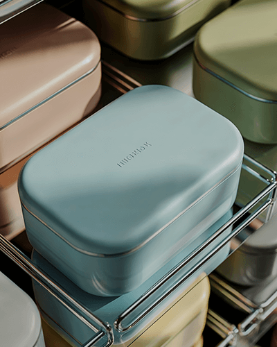 Pastel Blue Bento Box Sticker Mockup On Metal Shelf With Minimal Lighting