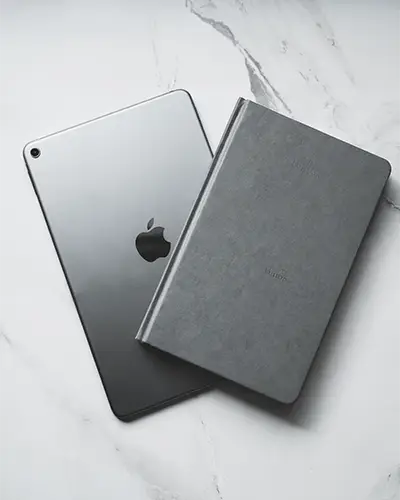 Modern Electronic Tablet With Hardcover Notebook Sticker Mockup On Marble Background