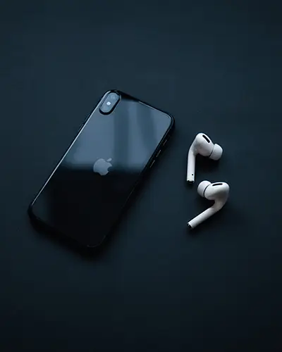 Smartphone Sticker Mockup With Airpods On Dark Studio Background Premium Style