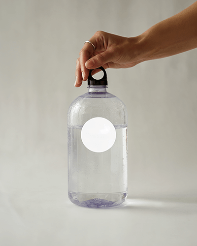 Studio Lighting Water Bottle Sticker Mockup With Simple Hand Grab Over Soft Plain Background 0272