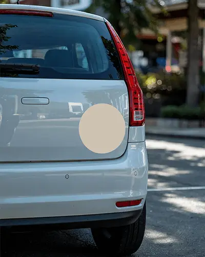 rear-view-car-bumper-sticker-mockup-on-white-vehicle-in-daylight-street-scene