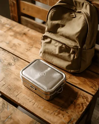 School Lunchbox With Sticker Mockup On Vintage Wooden Surface
