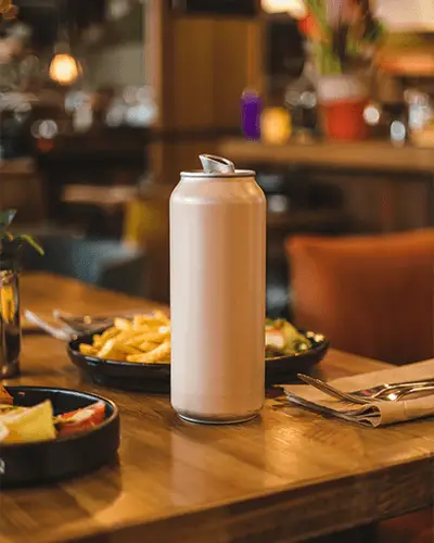 Restaurant Table Can Sticker Mockup With Food And Cozy Lighting