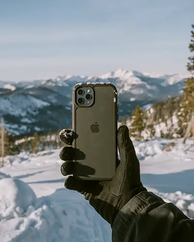 handheld-phone-mockup-in-gloved-hand-outdoor-winter-environment-for-tech-accessory-showcase