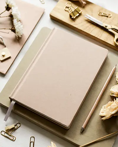 flat-lay-of-elegant-journals-sticker-mockup-with-clip-and-scissors-on-beige-background