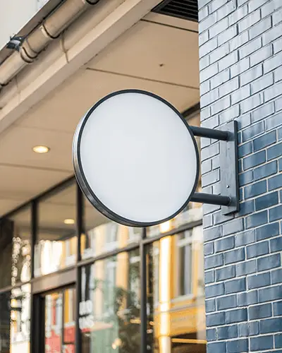 Round Outdoor Signage Sticker Mockup For Store Front Advertising And Brand Promotion Display