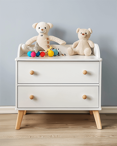 Aesthetic Nursery Sticker Mockup Wooden Legged Dresser With Soft Plush Toys And Warm Lighting