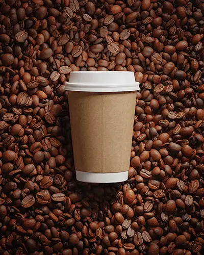 coffee-cup-sticker-mockup-surrounded-by-roasted-beans-for-branding