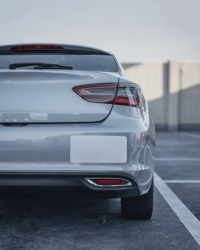 realistic-car-bumper-sticker-mockup-and-taillight-photo