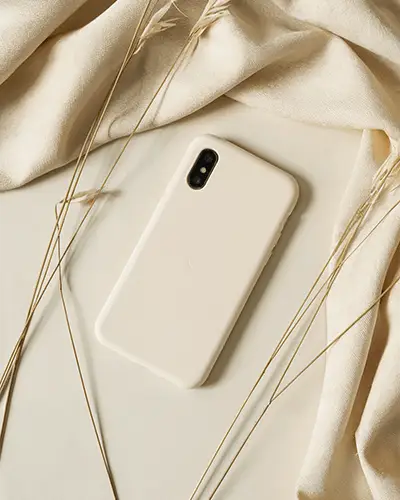 minimalistic-phone-case-sticker-mockup-with-elegant-texture-and-soft-fabric-background