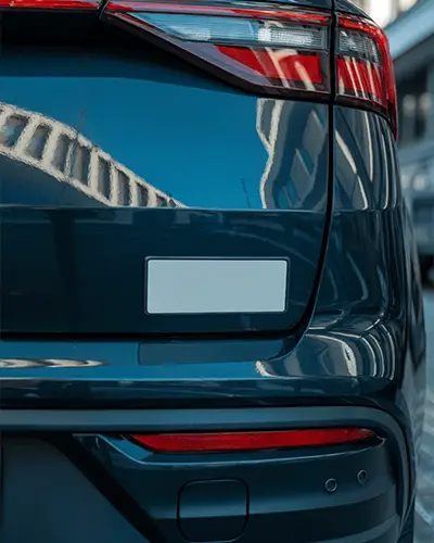 Sleek Car Sticker Mockup On Rear Bumper With Reflective Surface And Urban Background