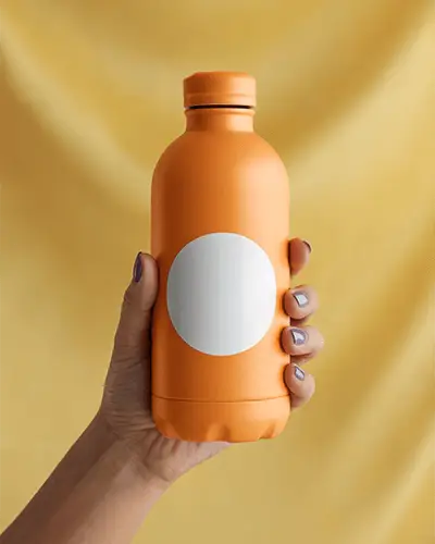 Hand Holding Stylish Water Bottle With Round Sticker Mockup For Branding Promotion
