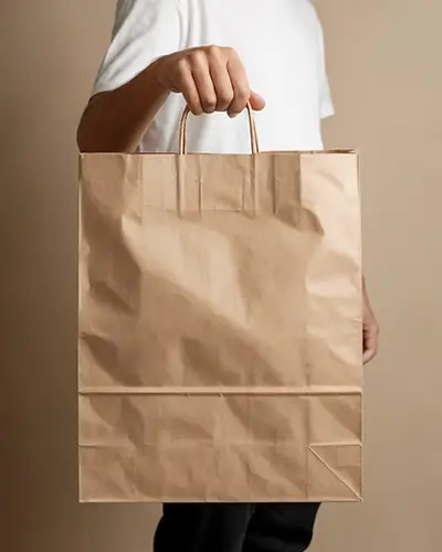 Hand Holding Kraft Paper Bag Sticker Mockup For Eco Friendly Retail Branding Presentation