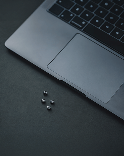 Sleek Metallic Laptop Mockup Modern Keyboard Dark Ambient Lighting