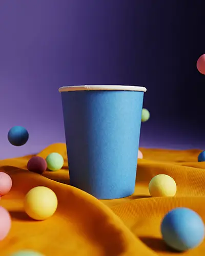 Isolated Blue Cup Sticker Mockup With Floating Ball Decor On Bright Fabric Textured Surface