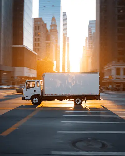 Fast Moving Box Truck On Busy City Road Business Shipping And Sticker Mockup