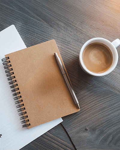 Minimalist Notebook Sticker Mockup Kraft Cover With Metal Pen On Rustic Wooden Desk