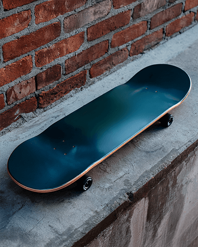 Grunge Style Skateboard Mockup Dark Deck On Rough Textured Concrete Surface