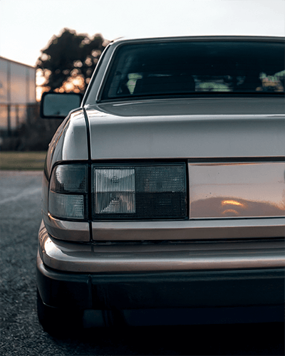 Retro Car Sticker Mockup Close Up Taillight On Metallic Body At Sunset