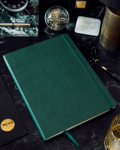 Green Leather Notebook Sticker Mockup On Dark Marble Desk With Luxury Writing Accessories For Elegant Workstation