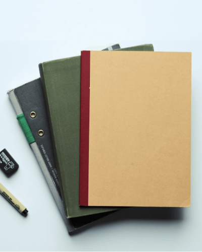 Notebook Sticker Mockup With Other Journals On Desk For Organized And Professional Look