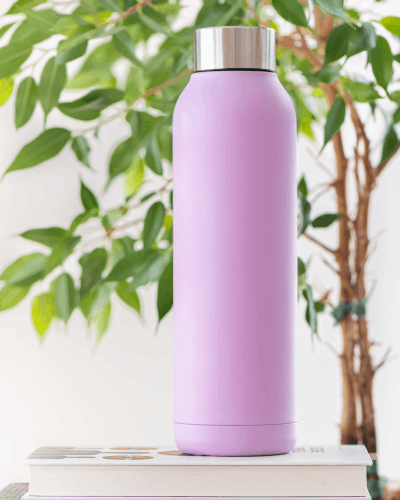 Pink Water Bottle Sticker Mockup With Greenery Background For Fresh And Inviting Aesthetic