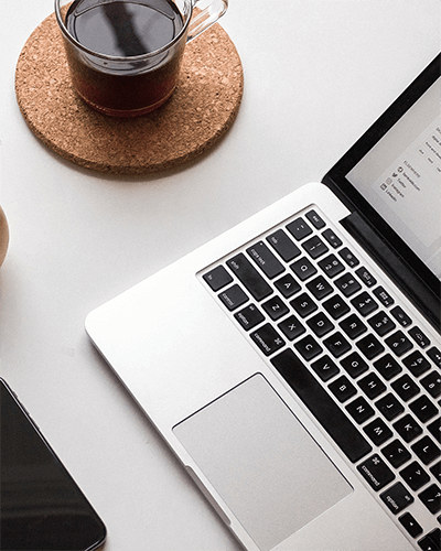 Macbook Laptop Sticker Mockup With Coffee Cup On Desk For Stylish And Relaxed Workspace Scene 0027