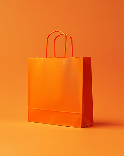 Orange Paper Bag Sticker Mockup In Studio Lighting Bold And Contrasting Presentation