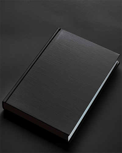 Flat Black Notebook Sticker Mockup On Dark Textured Surface With Subtle Lighting Modern Aesthetic