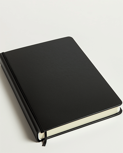 Angled Black Diary Sticker Mockup On White Background Classic And Clean Presentation