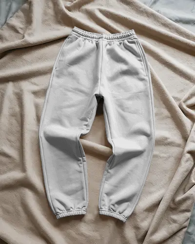 stylish-sweatpants-mockup-cozy-athleisure-flat-lay-on-textured-cloth-surface