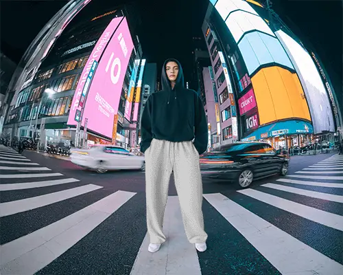 Neon City Sweatpants Mockup Person In Hoodie Standing On Crosswalk Night Style