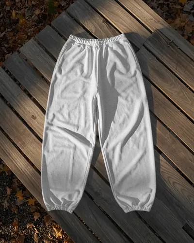 Natural Light Sweatpants Mockup Flat Lay On Wooden Planks Outdoor Setting