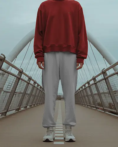 Urban Bridge Sweatpants Mockup Relaxed Model Standing Centered On Modern Arched Walkway