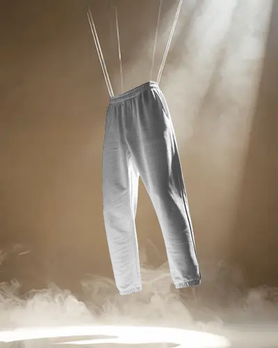 elegant-sweatpants-mockup-suspended-on-ropes-with-dramatic-spotlight-and-fog