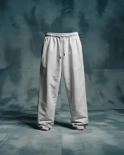 Moody Studio Sweatpants Mockup Front View On Blue Toned Textured Backdrop With Dramatic Light