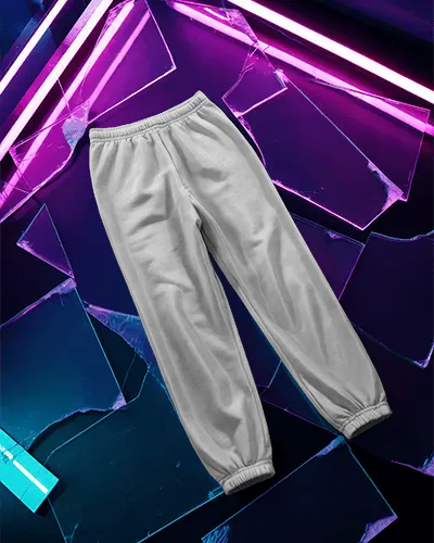 flatlay-sweatpant-mockup-on-broken-glass-surface-with-vivid-purple-and-blue-neon-lighting