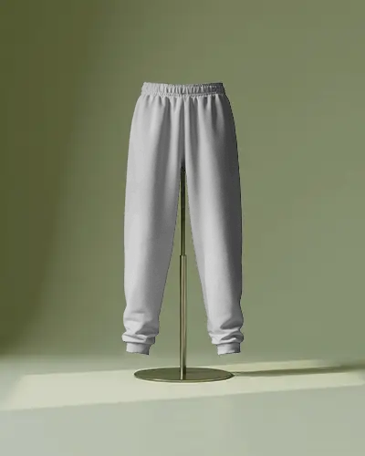 Elevated Sweatpants Mockup On Stand Soft Green Backdrop With Minimal Studio Lighting