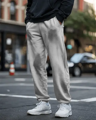 male-model-wearing-sweatpant-mockup-on-urban-street-paired-with-white-sneakers-casual-style