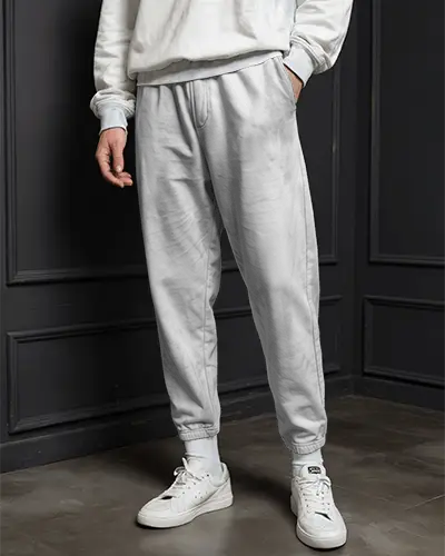 urban-studio-sweatpants-mockup-male-model-hands-in-pockets-relaxed-fit-minimal-dark-setting