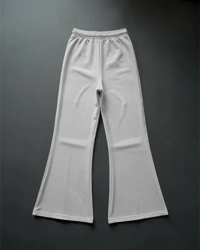 flared-sweatpants-mockup-flatlay-on-dark-floor-wide-leg-style-clean-minimal-fashion-layout