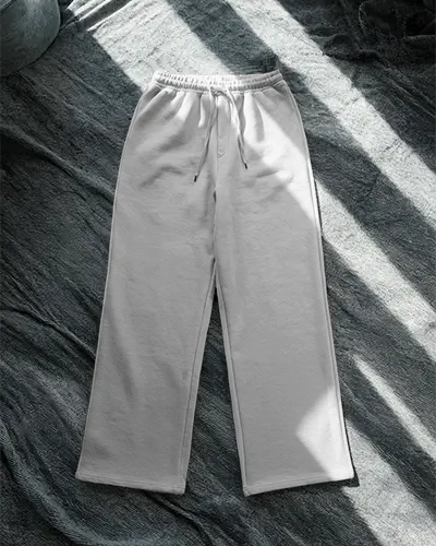 flatlay-sweatpants-mockup-on-fabric-surface-soft-light-shadows-modern-stylish-fashion-shot