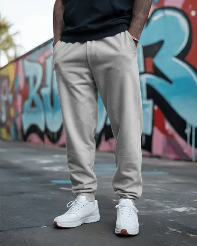 graffiti-street-sweatpants-mockup-male-model-posing-with-white-sneakers-urban-vintage-vibe