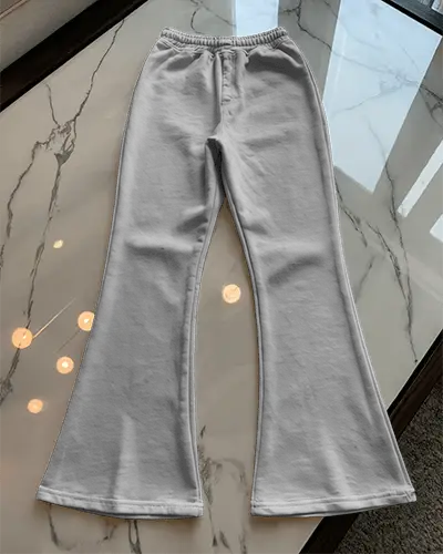 flared-sweatpants-mockup-flatlay-on-polished-floor-luxury-modern-fashion