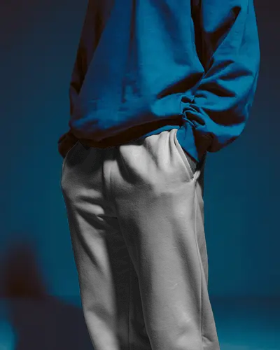 Casual Studio Sweatpants Mockup Paired With Sweatshirt Under Blue Light
